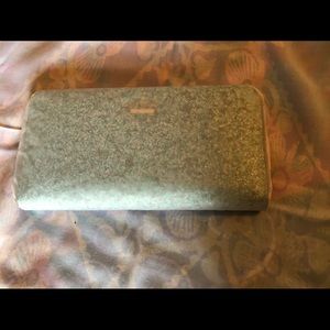 Brand new glittery light blue zip around wallet.